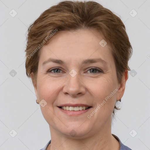 Joyful white adult female with short  brown hair and grey eyes