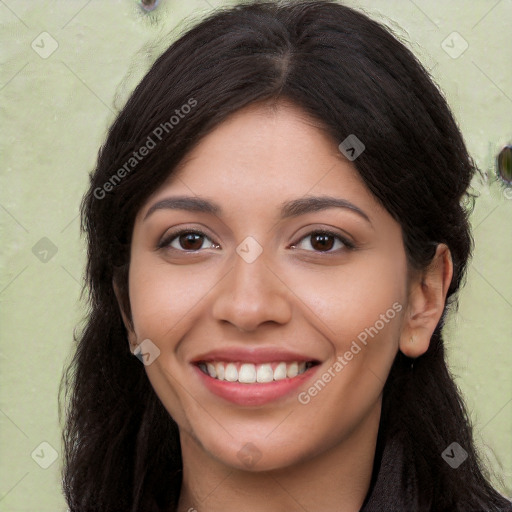 Joyful white young-adult female with long  black hair and brown eyes