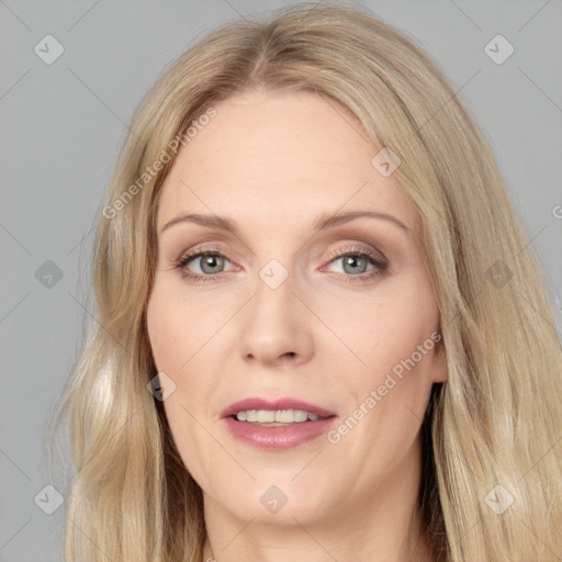 Joyful white adult female with long  brown hair and grey eyes