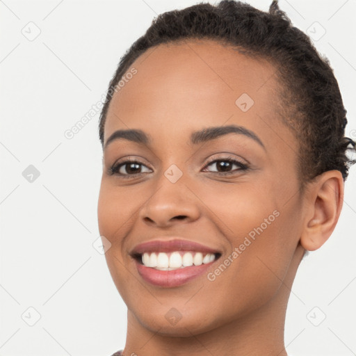 Joyful latino young-adult female with short  brown hair and brown eyes