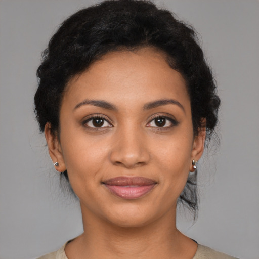 Joyful latino young-adult female with medium  black hair and brown eyes