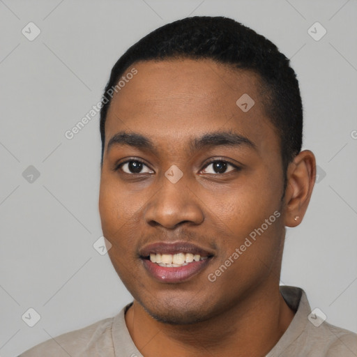 Joyful black young-adult male with short  black hair and brown eyes