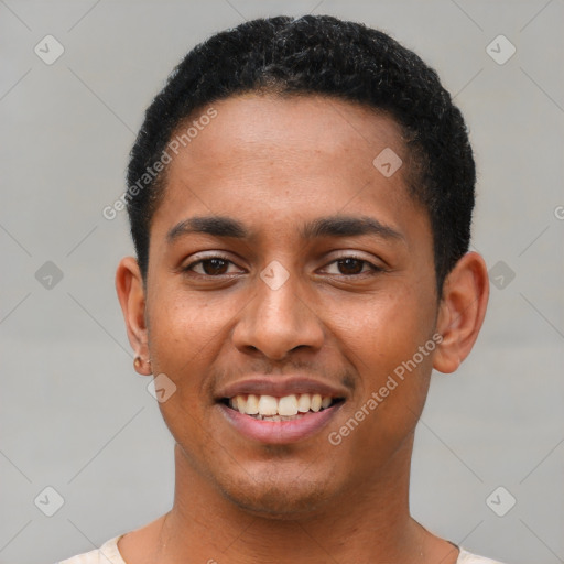 Joyful latino young-adult male with short  black hair and brown eyes