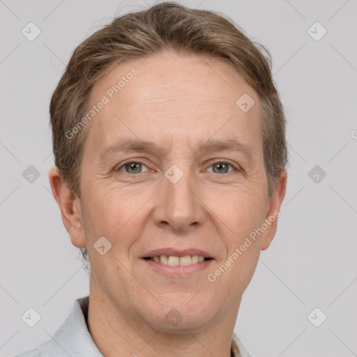 Joyful white adult male with short  brown hair and grey eyes