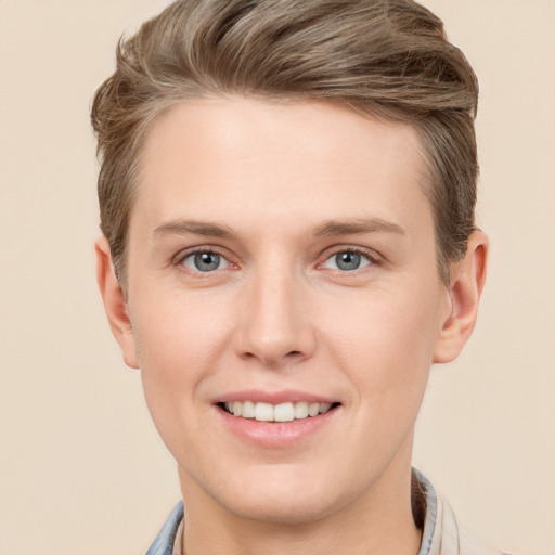 Joyful white young-adult female with short  brown hair and grey eyes