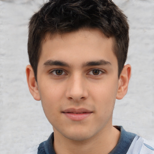 Joyful white child male with short  brown hair and brown eyes