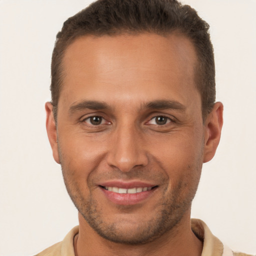 Joyful white adult male with short  brown hair and brown eyes