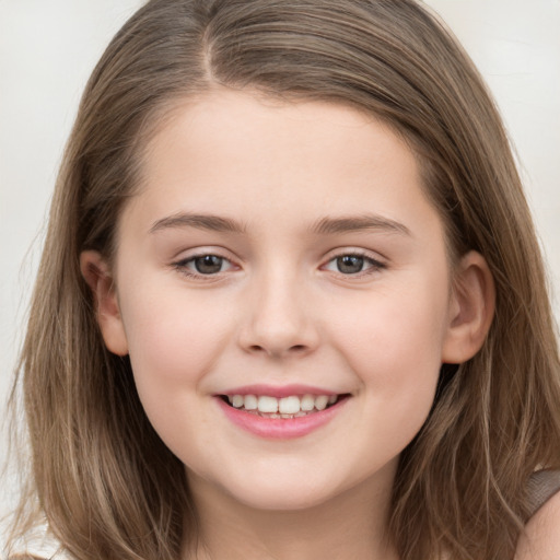 Joyful white child female with long  brown hair and brown eyes