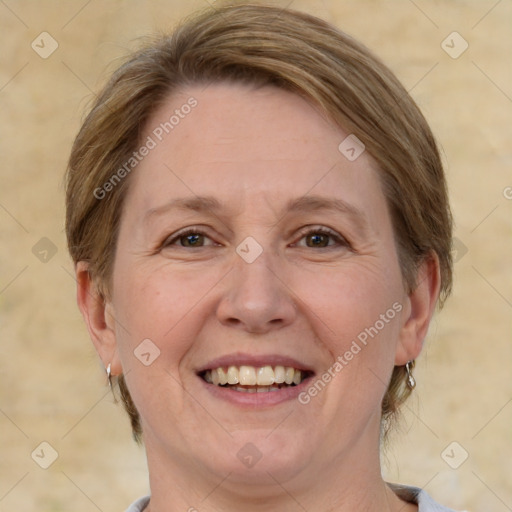 Joyful white adult female with medium  brown hair and brown eyes