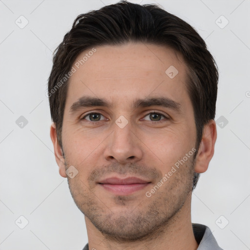 Joyful white young-adult male with short  brown hair and brown eyes