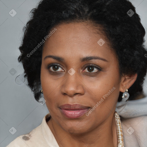 Joyful black adult female with medium  brown hair and brown eyes