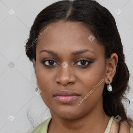 Joyful black young-adult female with long  brown hair and brown eyes