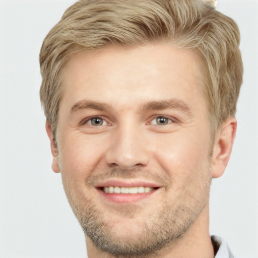 Joyful white adult male with short  brown hair and grey eyes