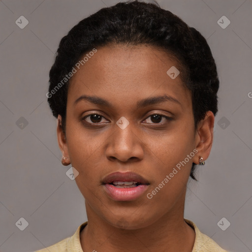 Joyful black young-adult female with short  black hair and brown eyes