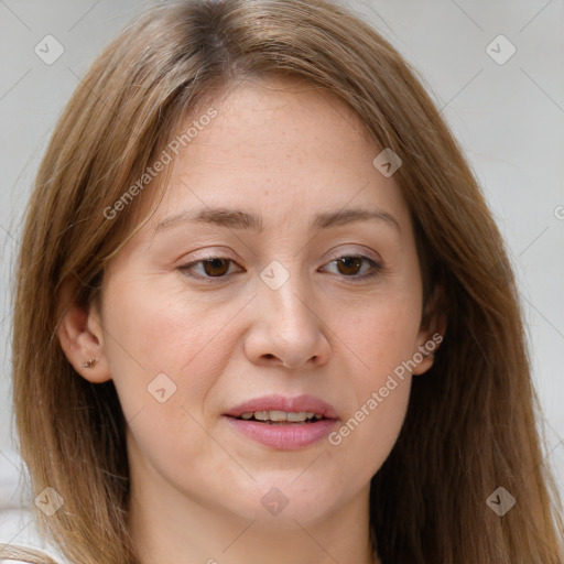 Joyful white adult female with long  brown hair and brown eyes