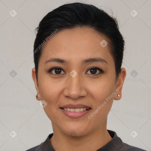 Joyful asian young-adult female with short  brown hair and brown eyes