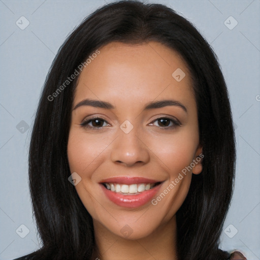 Joyful latino young-adult female with long  brown hair and brown eyes