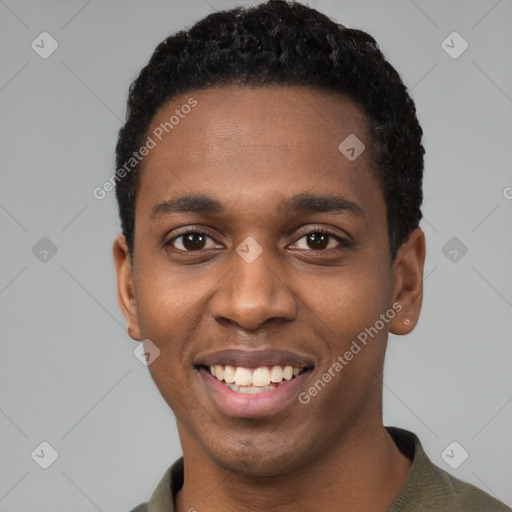 Joyful black young-adult male with short  black hair and brown eyes