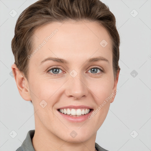 Joyful white young-adult female with short  brown hair and grey eyes