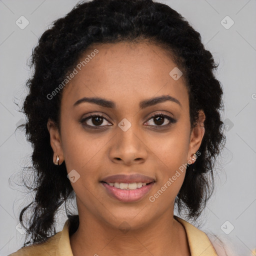 Joyful black young-adult female with long  black hair and brown eyes