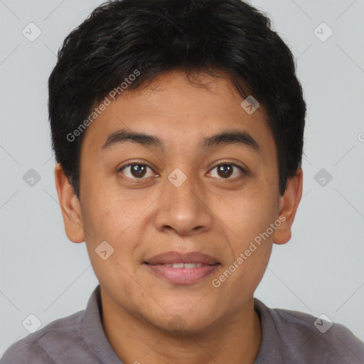 Joyful asian young-adult male with short  brown hair and brown eyes