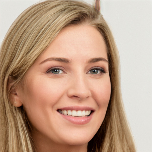 Joyful white young-adult female with long  brown hair and grey eyes