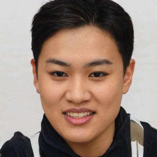Joyful asian young-adult female with short  brown hair and brown eyes