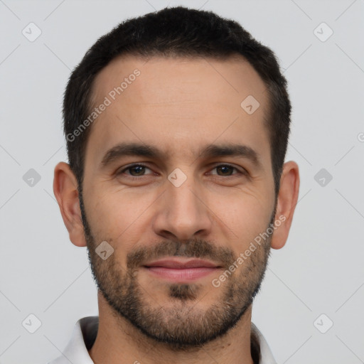 Joyful white young-adult male with short  black hair and brown eyes