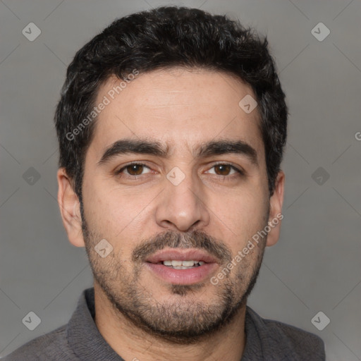 Joyful white young-adult male with short  black hair and brown eyes