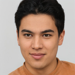 Joyful latino young-adult male with short  brown hair and brown eyes