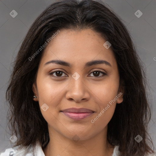 Joyful latino young-adult female with long  brown hair and brown eyes