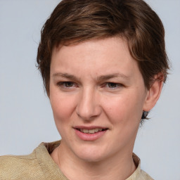 Joyful white young-adult female with medium  brown hair and blue eyes