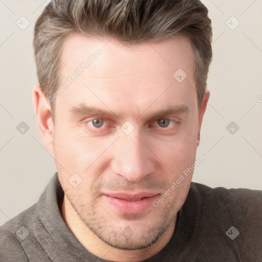 Joyful white adult male with short  brown hair and grey eyes