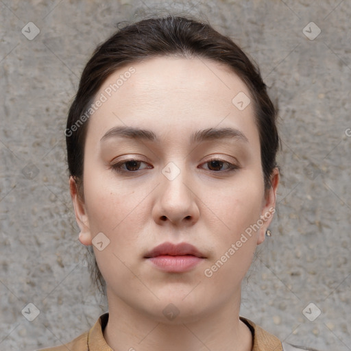 Neutral white young-adult female with short  brown hair and brown eyes