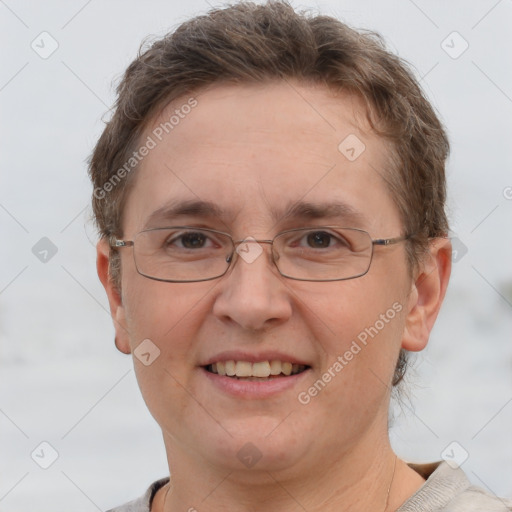 Joyful white adult female with short  brown hair and grey eyes