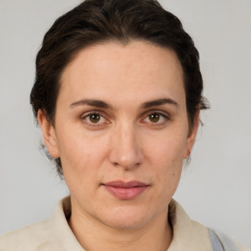 Joyful white adult female with short  brown hair and brown eyes