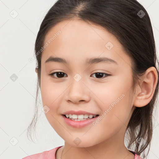 Joyful white child female with medium  brown hair and brown eyes