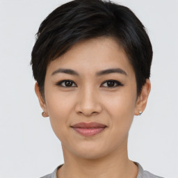 Joyful asian young-adult female with short  black hair and brown eyes