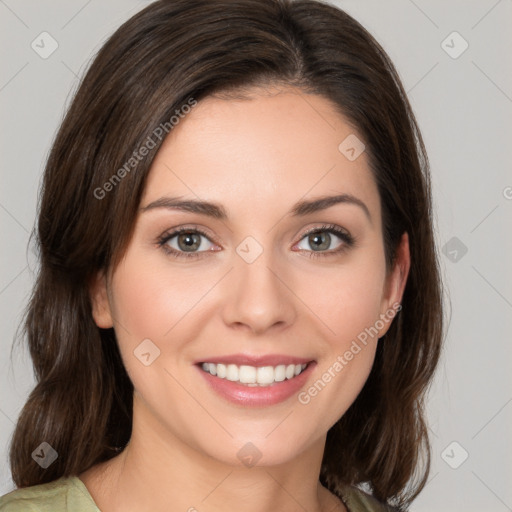 Joyful white young-adult female with medium  brown hair and green eyes