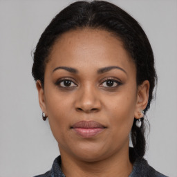 Joyful latino young-adult female with medium  black hair and brown eyes