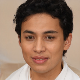 Joyful latino young-adult male with short  brown hair and brown eyes