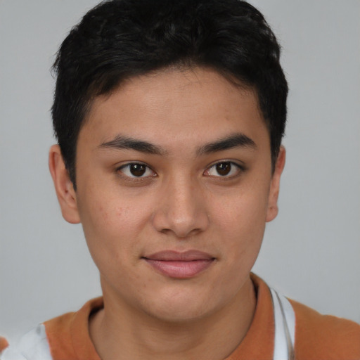 Joyful asian young-adult female with short  brown hair and brown eyes