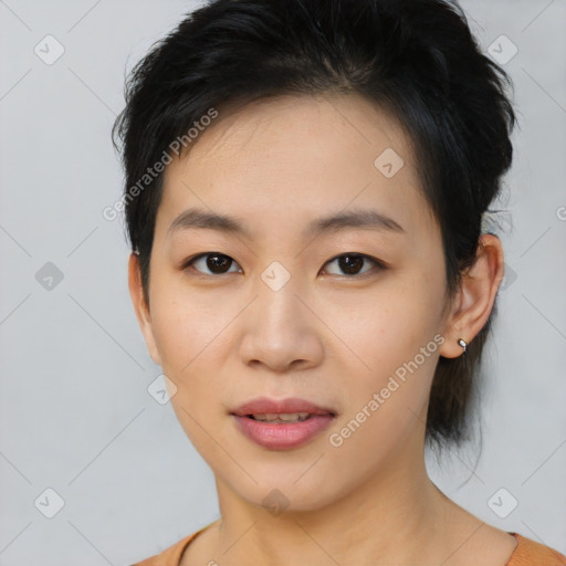 Joyful asian young-adult female with short  brown hair and brown eyes