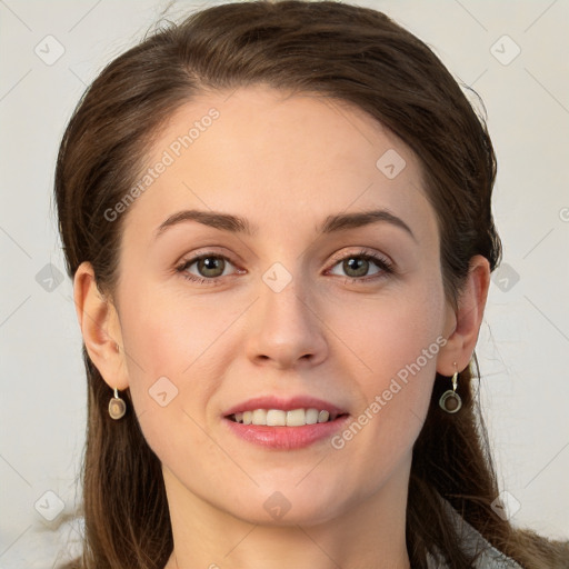 Joyful white young-adult female with long  brown hair and grey eyes