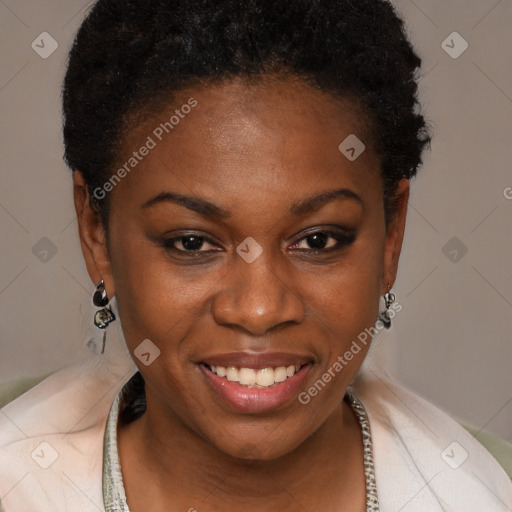 Joyful black young-adult female with short  brown hair and brown eyes