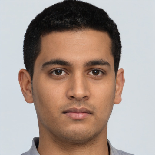 Neutral latino young-adult male with short  brown hair and brown eyes