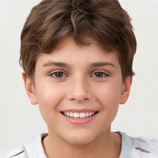 Joyful white child male with short  brown hair and brown eyes