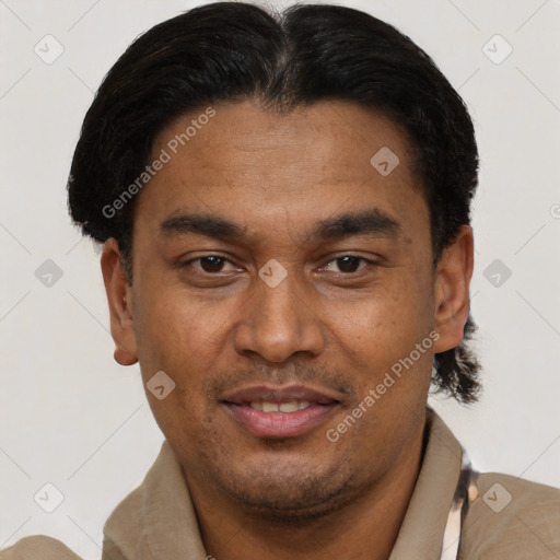 Joyful latino young-adult male with short  black hair and brown eyes