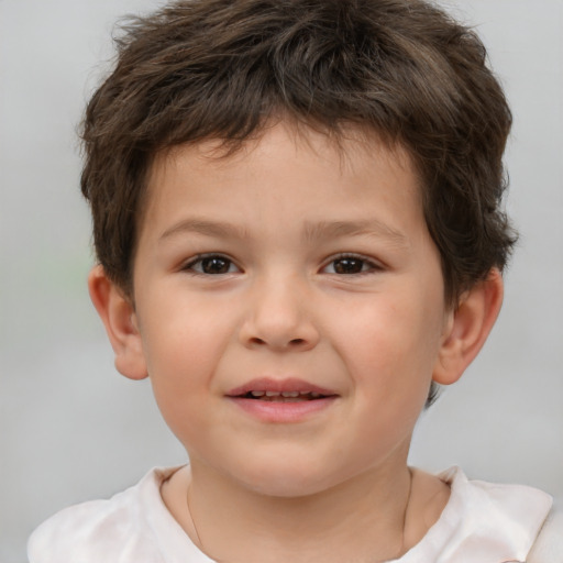 Joyful white child male with short  brown hair and brown eyes