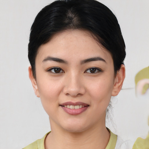 Joyful white young-adult female with medium  black hair and brown eyes